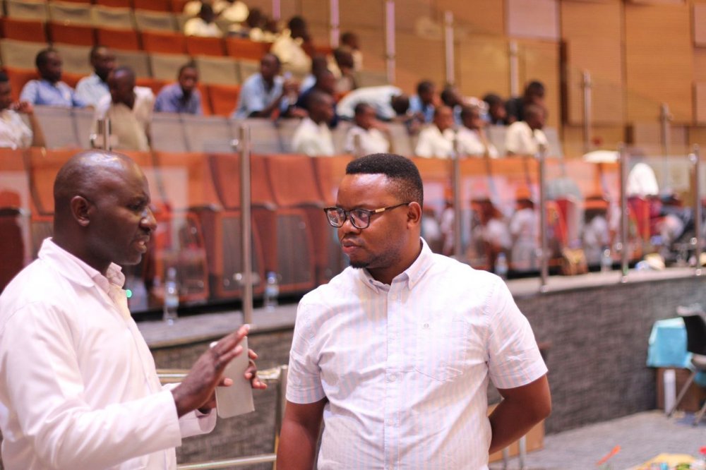 The Principal of NGA, Tuyisenge Jean Claude chatting with the Permanent Secretary in MINICT, Iradukunda Yves.  