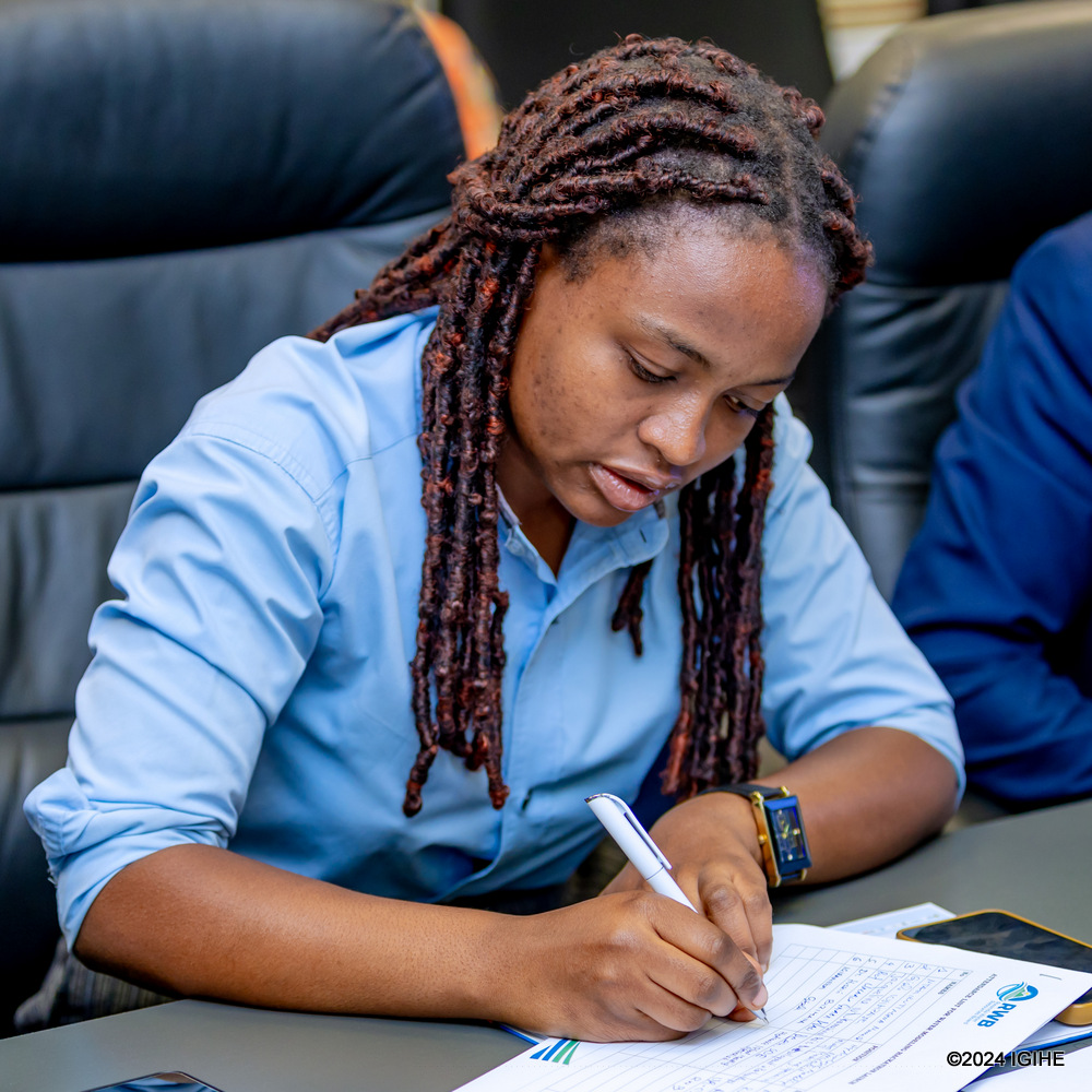 University of Rwanda final-year Engineering student, Gisele Igiraneza, takes notes during the event