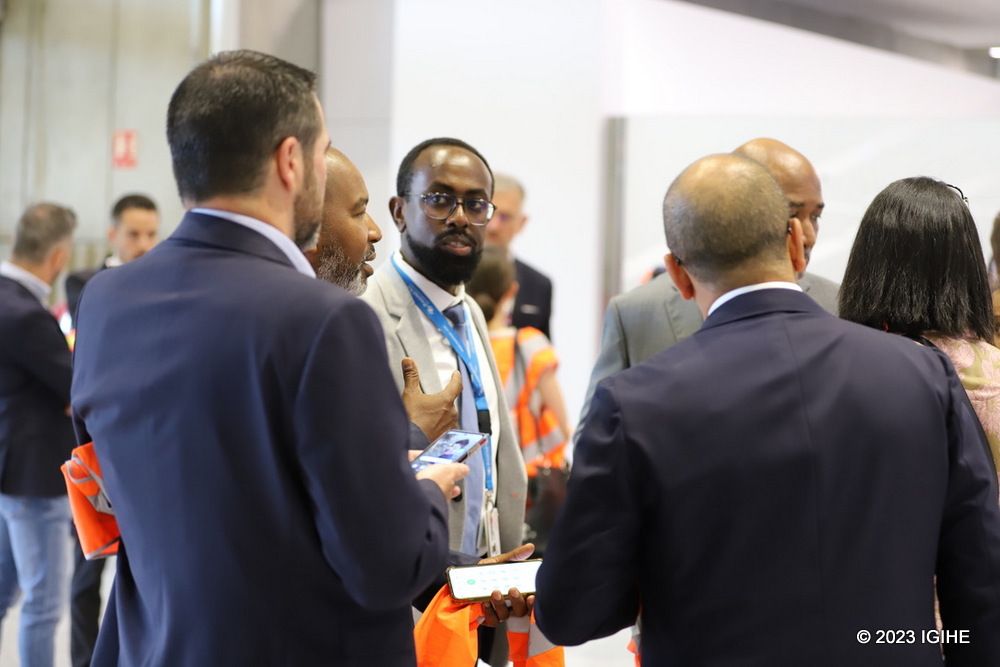 RwandAir's representative in Belgium, Gashumba Charles Damascène, converses with the guests who came to celebrate RwandAir's inaugural flight to Paris.