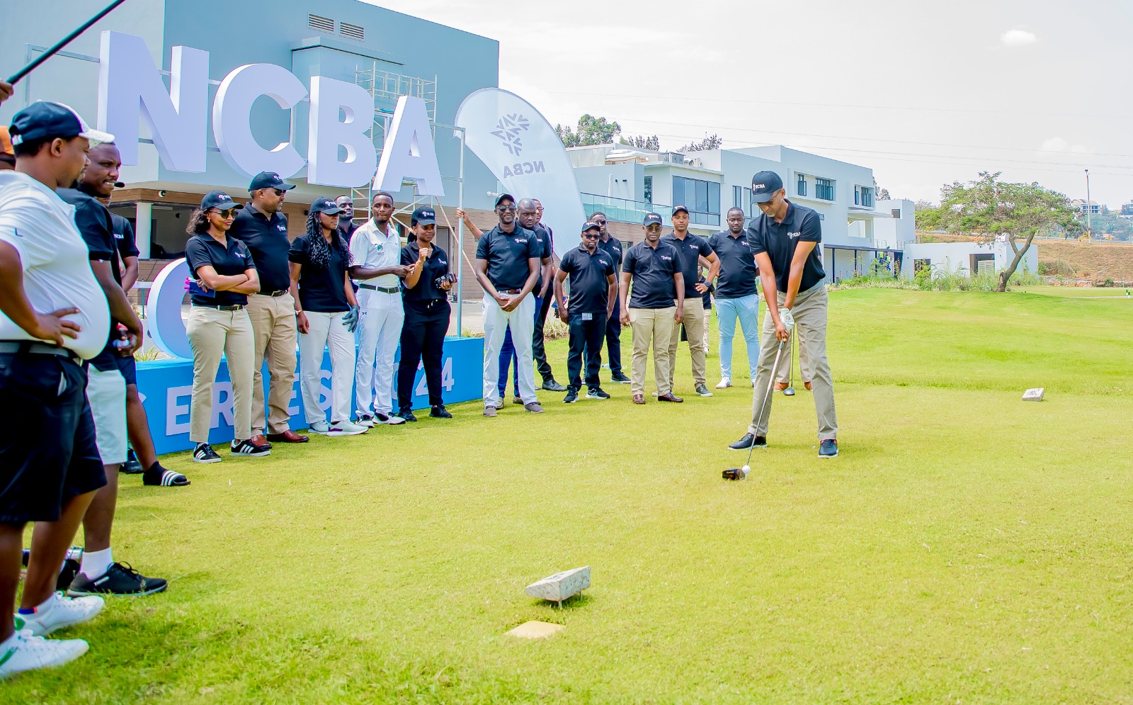 Marcel Byusa, the President of Kigali Golf Club aims to strike the golf ball with precision at the launch of the first NCBA Rwanda golf series at the Kigali Golf Resort and Villas.