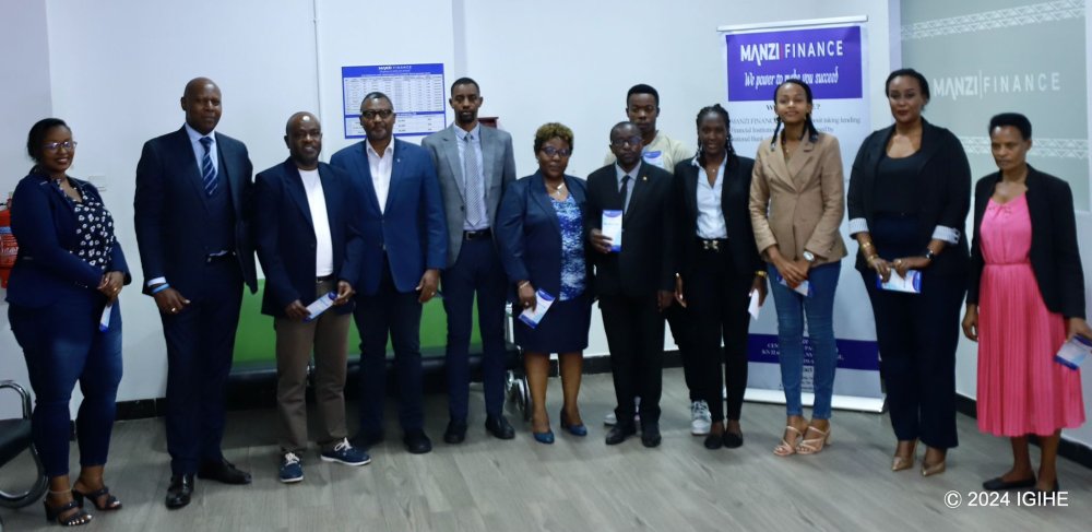 A group photo featuring employees of Manzi Finance Ltd.