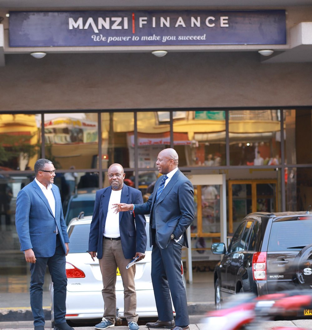 Mugabo Ignatius, Manzi Aloys, and an IGIHE journalist visit the Manzi Finance office.