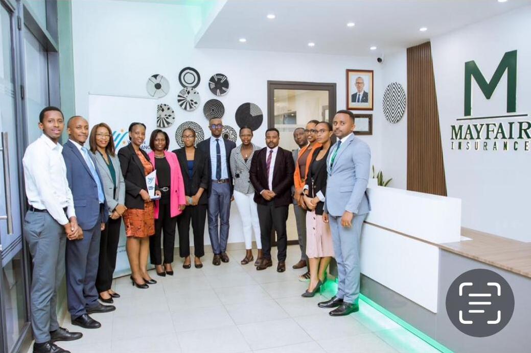 Mayfair Insurance staff, led by Managing Director Ms. Jessica Igoma, pose for a group photo with WIFR founding chair Ms. Lina Higiro and Zep-Re MD for Rwanda and Burundi, Ms. Alice Uwase.