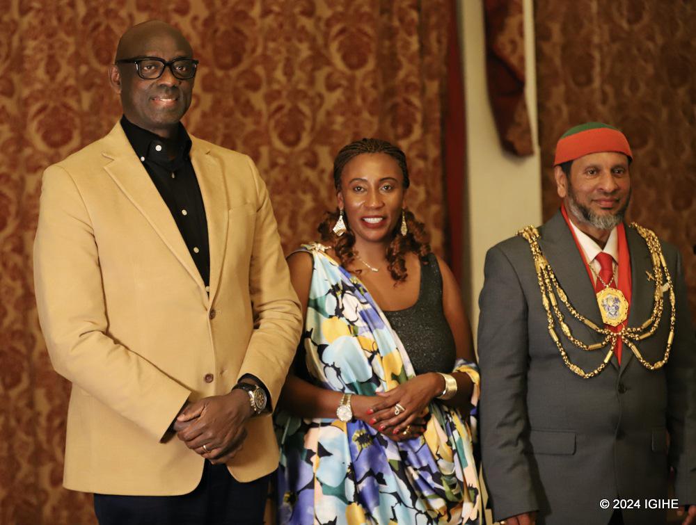 Amb. Johnston Busingye, Wibabara Ange who is among organizers of the event and uri mu the Mayor of Brighton Mohammed Asaduzzaman posing for a photo of sosuvenir.