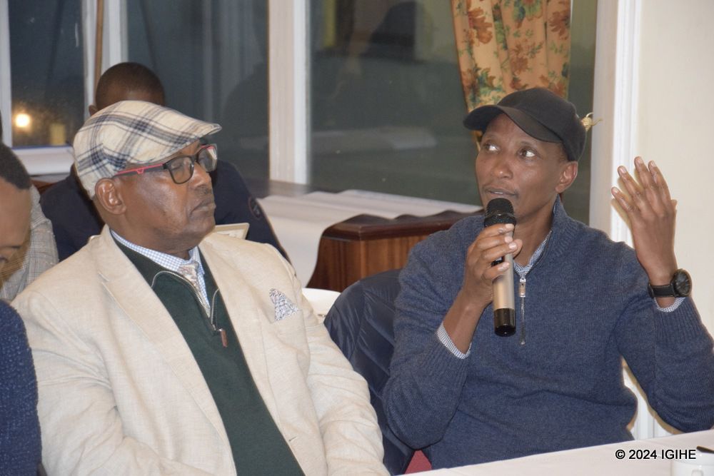 First Secretary of Rwanda High Commissioner in the UK , James Uwizeye sharing ideas.