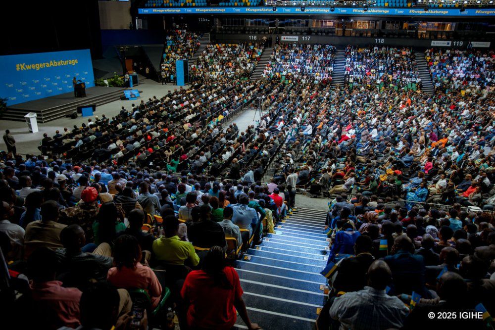 Attendees follow the proceedings of the President's citizen outreach program at BK Arena.
