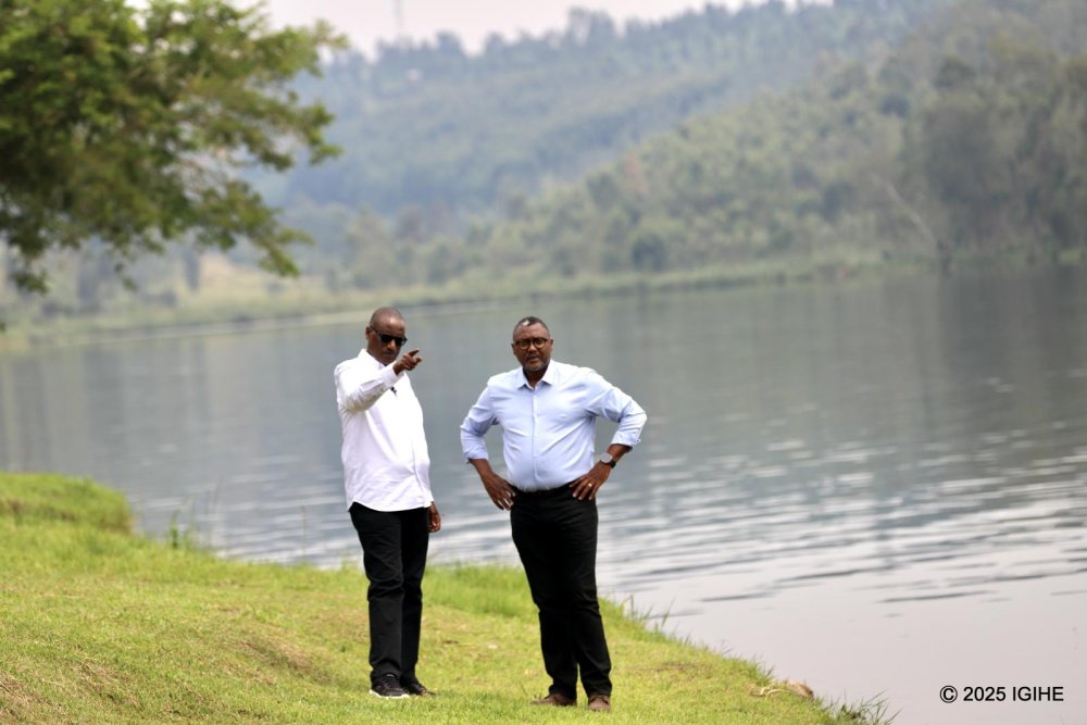 IGIHE journalist touring the surroundings of Muhazi Beach Resort along with the owner of the facility, Murenzi Donatien.