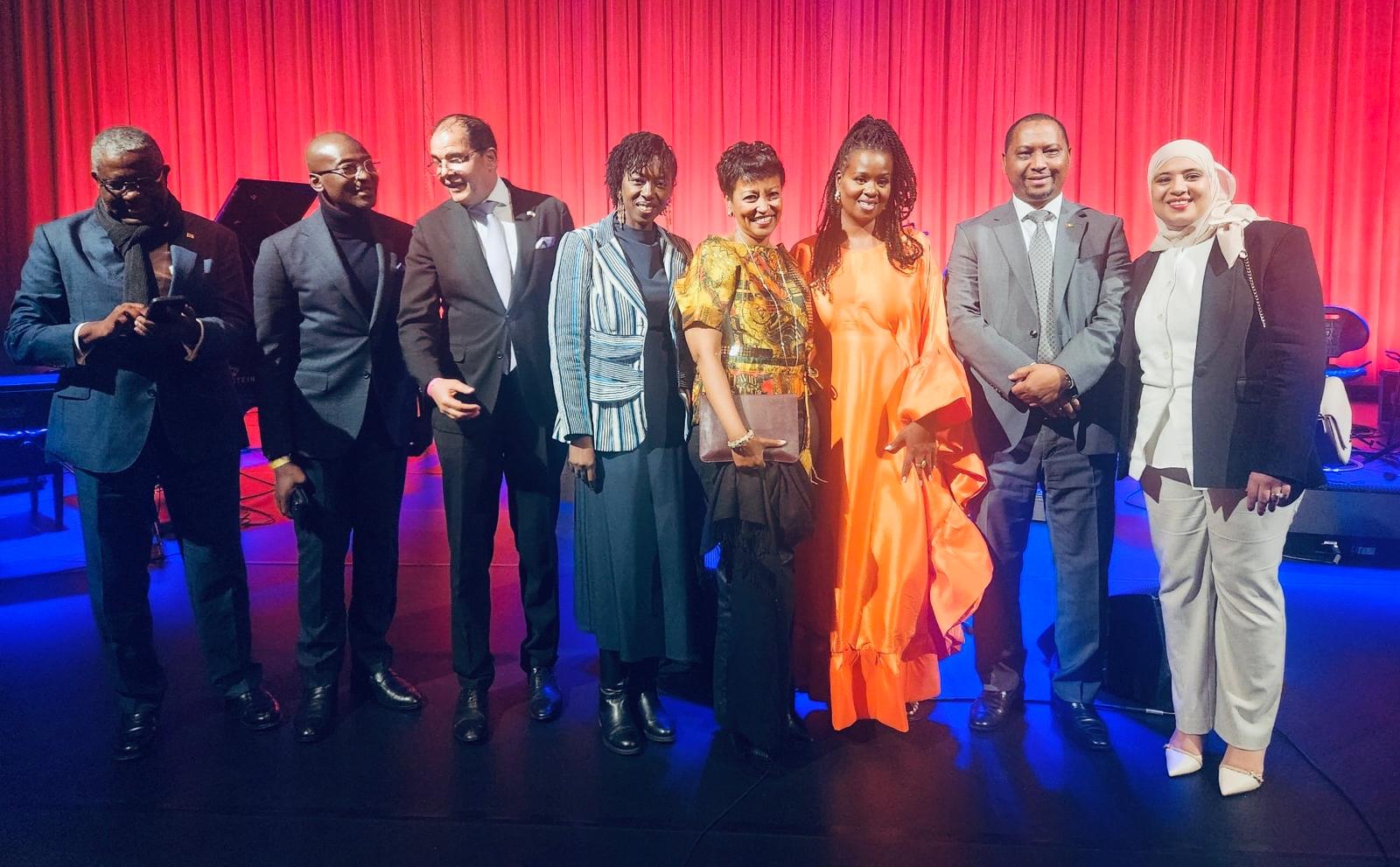 Somi Kakoma and her team, alongside Mrs. Jeanne Ndatirwa and her husband, Igor Cesar, Ambassador of Rwanda to Berlin. This photo was taken in the Miriam Makeba Hall at the House of World Cultures (Haus der Kulturen der Welt).