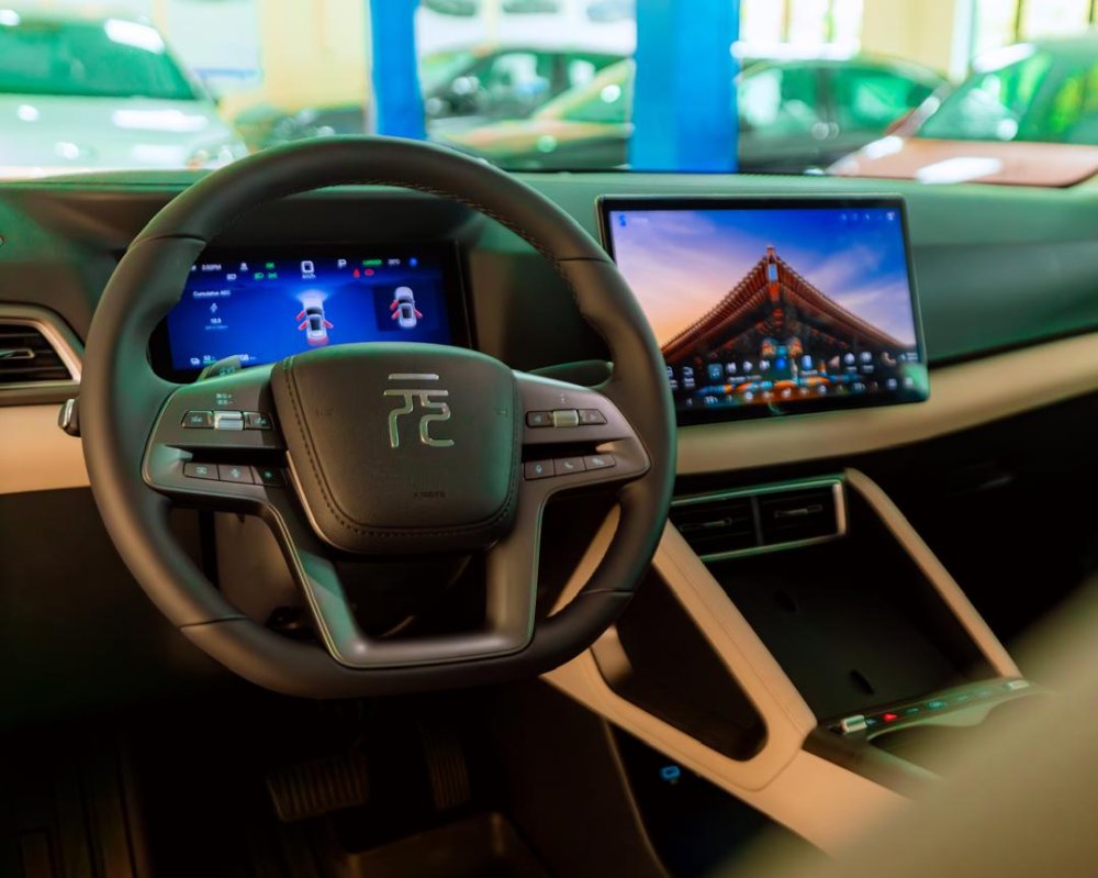 The vehicle features modern technology, including a spacious and stylish cabin, a 12-inch (30.48 cm) touchscreen infotainment system, and intuitive controls accessible directly from the steering wheel.