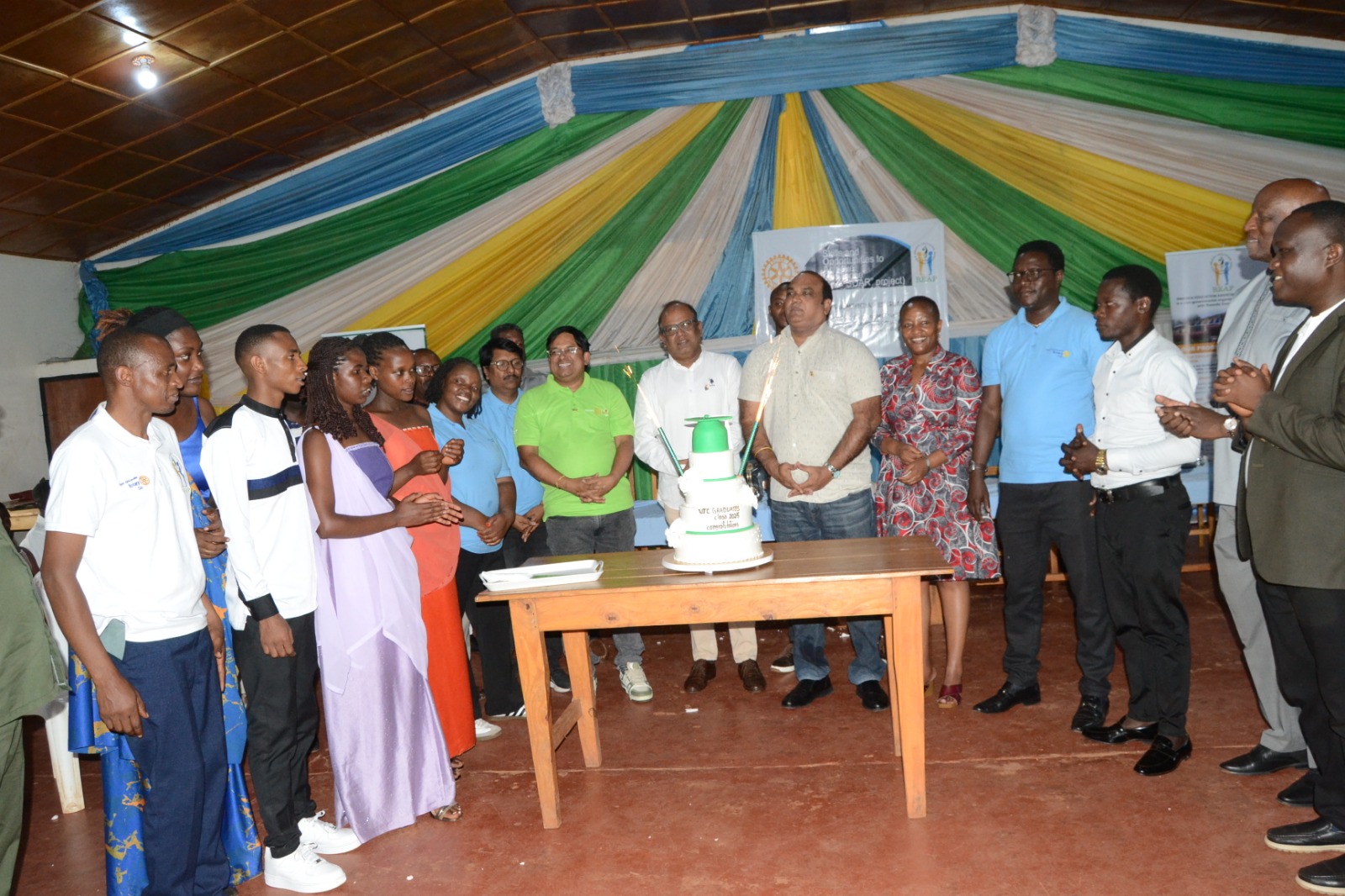 Rotary Club representatives and local leaders stand at the completion of the year-long skills training programme.