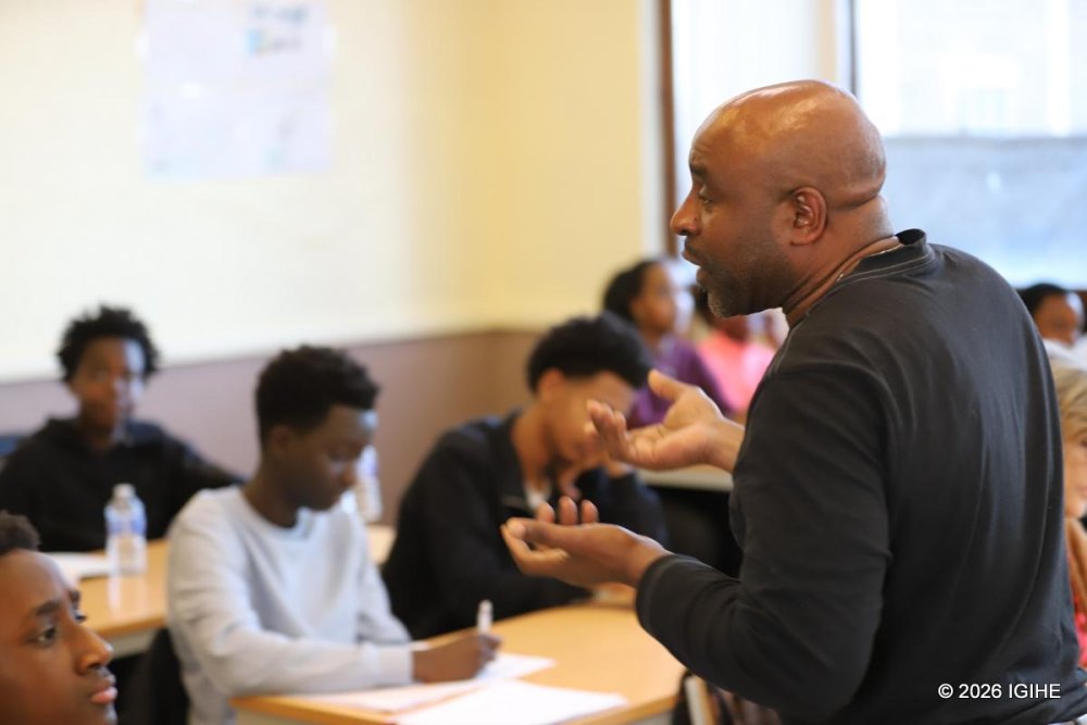 Teacher Christophe Icyitegetse instructs older students, aged 12 and above.
