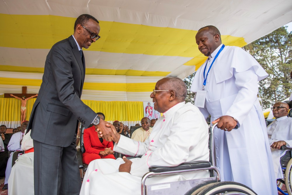 At the celebration of the 100th anniversary of the Catholic Priesthood in Rwanda, Bishop Eulade Rudahunga was greeted by President Kagame with whom they held hands