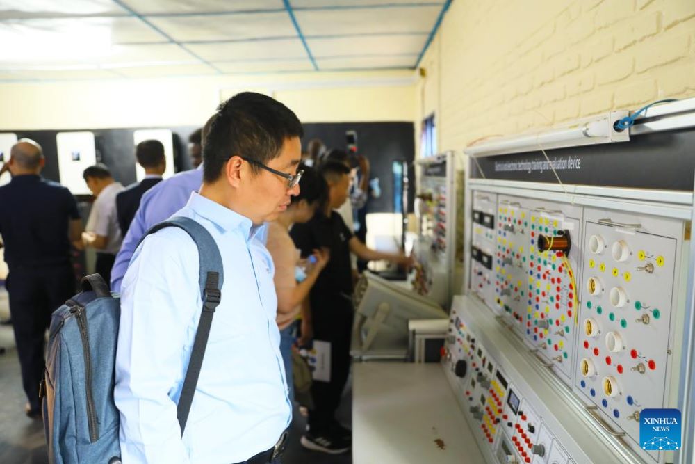 People look at a training device at the Chinese-built Forever TVET Institute in Kigali, Rwanda, on July 8, 2025. (Photo by Huang Wanqing/Xinhua)