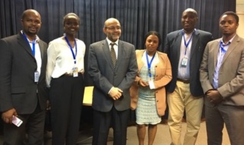 Yasser El-Gammal Country Manager for Rwandan Country Office, World Bank Group (centre) poses for a group photo with Inyenyeri staff