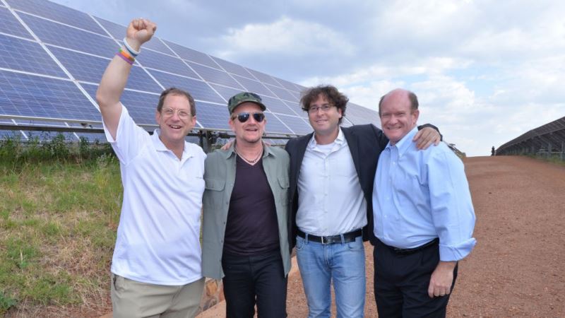 From left to right, Yosef Abramowitz, Bono, Chaim Motzen, and Delaware Senator Chris Coons at the solar field in Rwanda on August 25, 2015. (photo courtesy Yosef Abramowitz)