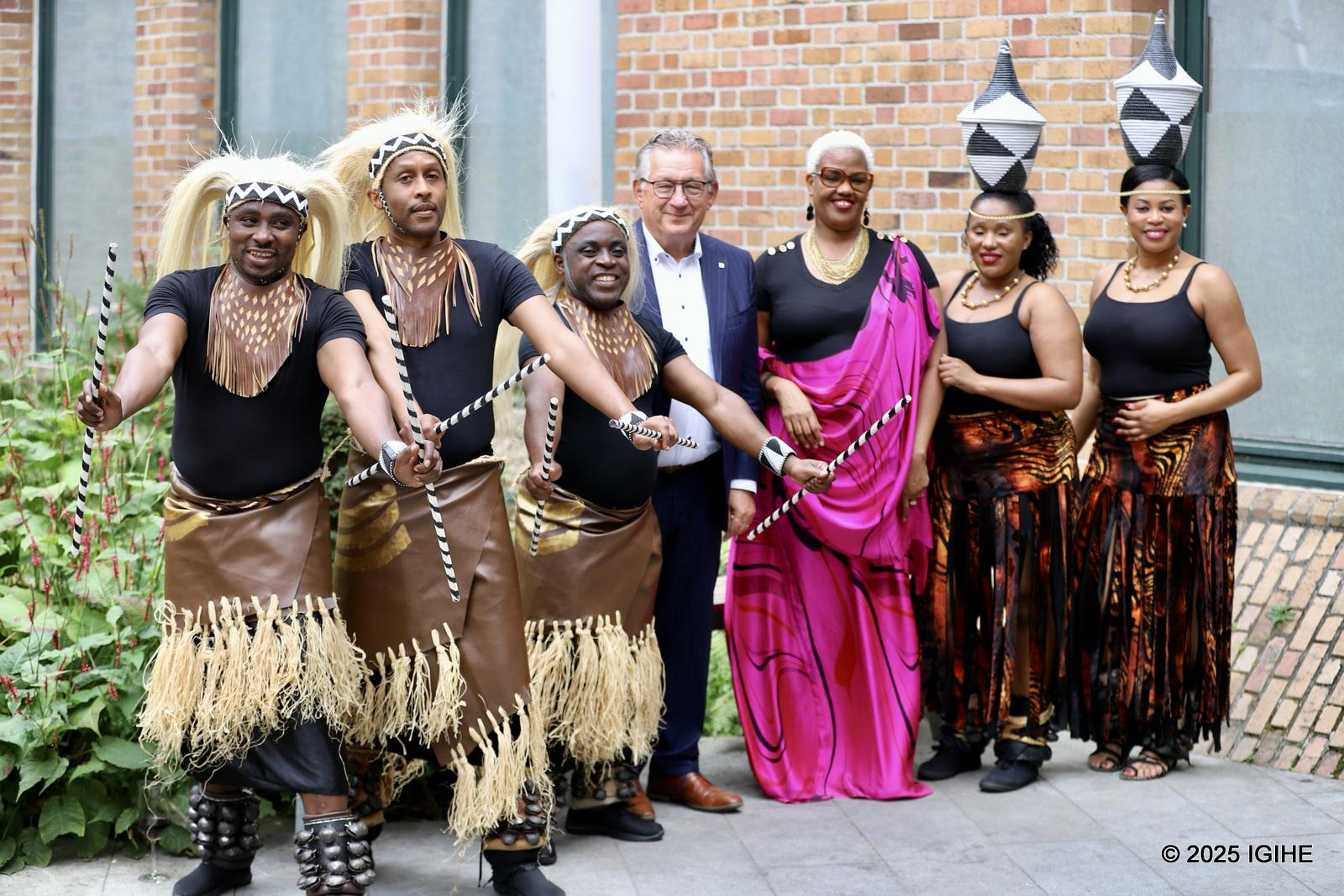 Yvette Umutangana and the Mayor of Brudges in a group photo with Rwandan dance troupe, Ballet IREBERO.